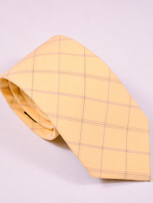  Krawat  męski z grafiką w żółto kremowo-beżową kratę. 